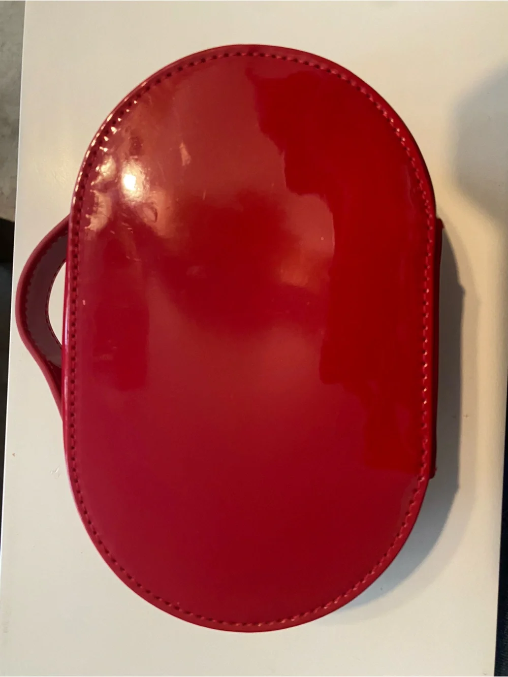 Dior Glossy Red Embossed Oval Cosmetic Case